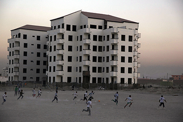 Young Afghans play football at a residential compound in the east of the city. Sport has flourished in Afghanistan over the past nine years. Kabul, 2011.