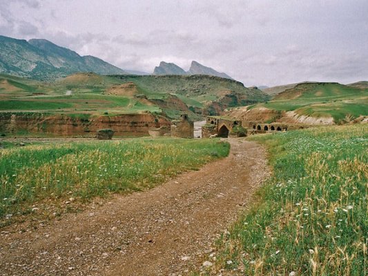 A few miles after ‘Darreh Shahr’, we reach ‘Gavmishan’ bridge. This bridge, built originally in Sassanian times, has been repaired and renovated many times over the centuries, and spans the ‘Seimareh’ river. The left side of the bridge is Ilam, and the right is Luristan.